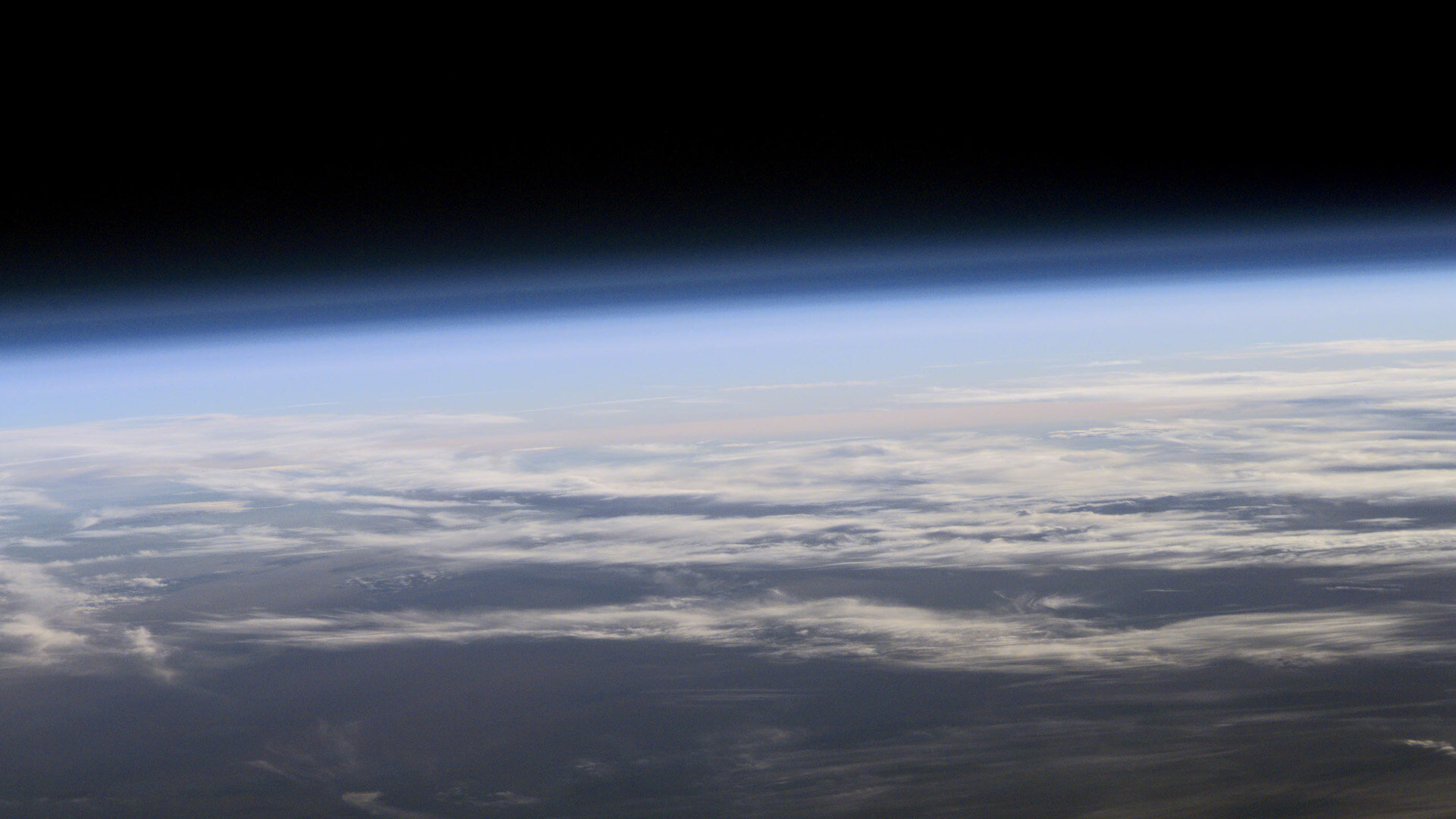 The Age-Oxygen Relationship: Testing Earth-like Atmospheric Evolution in Living Worlds